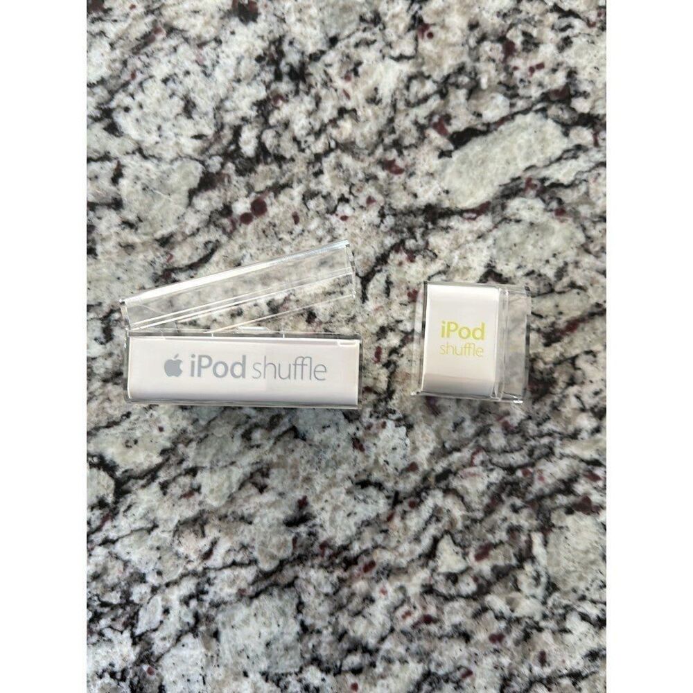 2 iPod shuffle empty boxes  one earphones NO iPODs